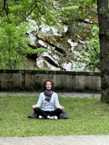 Olga meditates on the grass